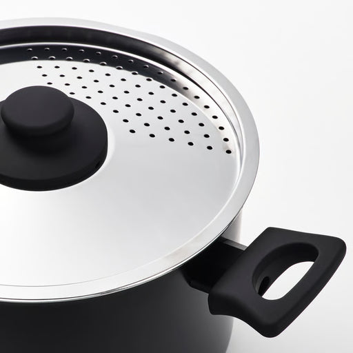 Close-up of IKEA HEMLAGAD pot lid with vent holes and comfortable handle