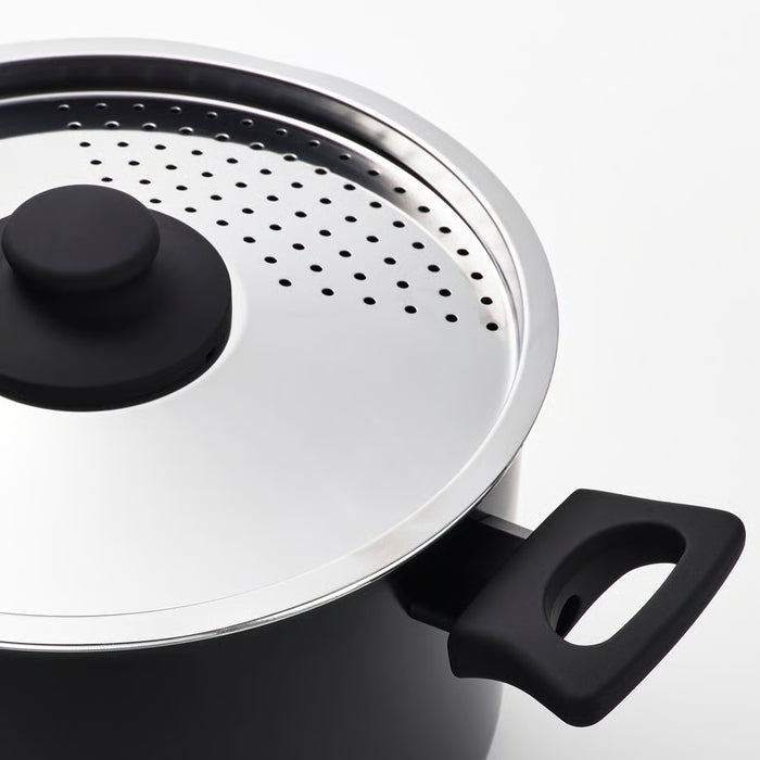 Close-up of IKEA HEMLAGAD pot lid with vent holes and comfortable handle
