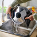 Pouring water out through IKEA HEMLAGAD pot lid into sink