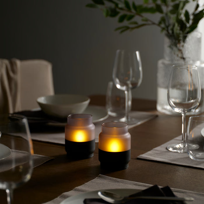 IKEA HJULMÖJA grey-black LED table decoration with frosted glass shade styled as a candle alternative