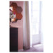 Room corner styled with large IKEA HÖNEFOSS mirror cluster on wall beside dark wood dresser