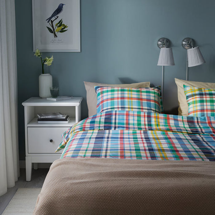 IKEA HÖSTGENTIANA duvet set styled on bed with throw and bedside decor