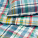 Close-up of IKEA HÖSTGENTIANA colourful check fabric pattern and texture