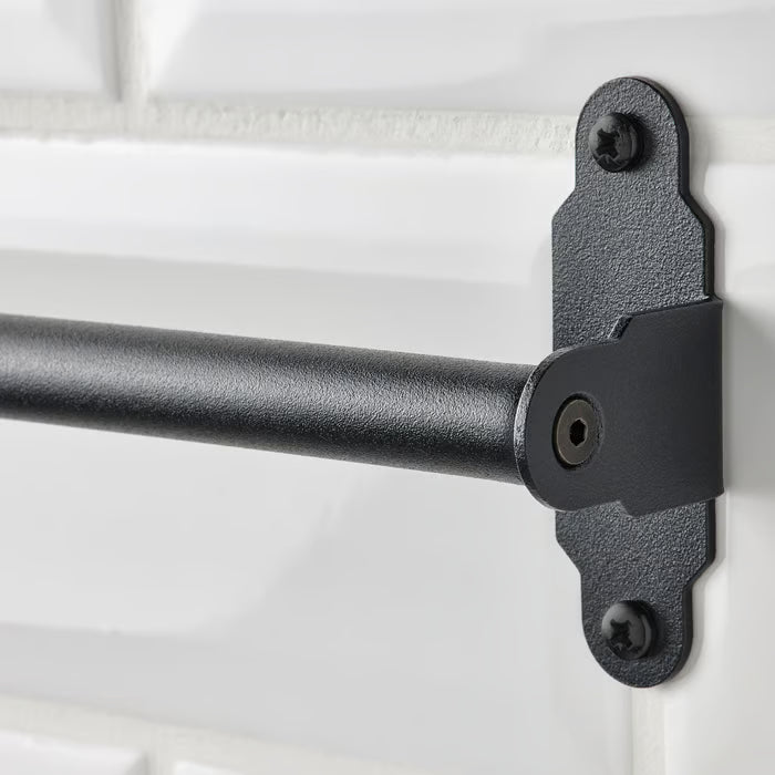 IKEA HULTARP black wall rail bracket close-up showing mounting point and powder-coat finish