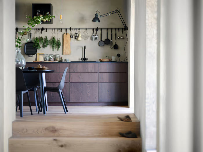 IKEA HULTARP black rail styled in modern kitchen with wooden cabinets, hooks and hanging tools