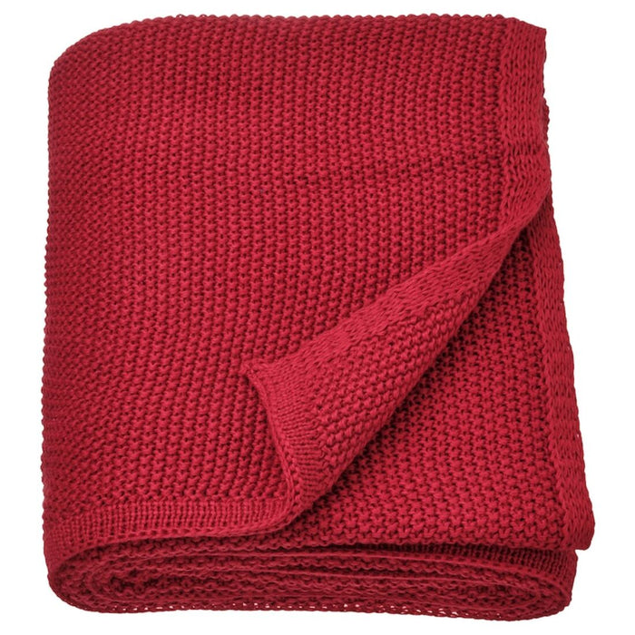 Dark red IKEA HUMLEMOTT throw, showcasing its soft, textured knit. 
