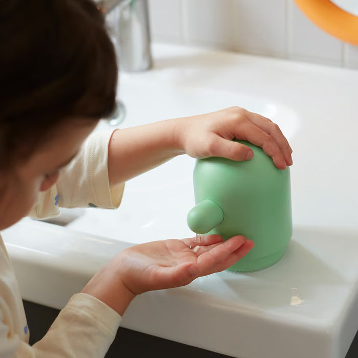 IKEA HUMLESJÖN light green soap dispenser side view showing full height and slim profile