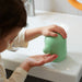 IKEA HUMLESJÖN light green soap dispenser side view showing full height and slim profile