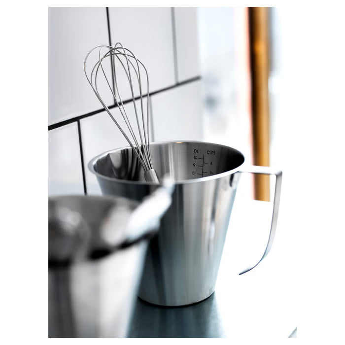  IKEA IDEALISK stainless steel measuring jug with wire whisk inside showing capacity and handle design