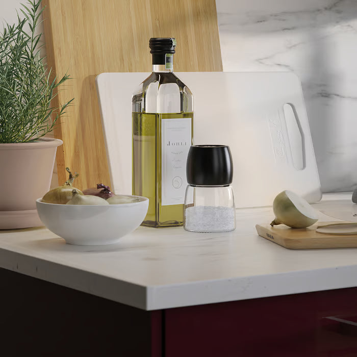 IKEA 365+ white bowl on kitchen counter beside oil bottle salt shaker and chopped onion