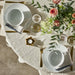  Table setting with IKEA IKEA 365+ white porcelain bowls gold cutlery and clear glasses on beige cloth