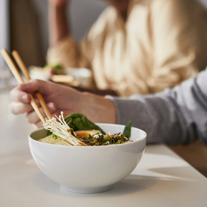 IKEA IKEA 365+ white bowl 16cm holding ramen noodles with chopsticks on wooden table