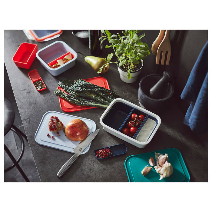 IKEA 365+ red blue and green chopping boards on table with assorted vegetables and food