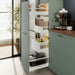 Open kitchen cabinet organised with IKEA 365+ jars and containers storing dry foods and oils