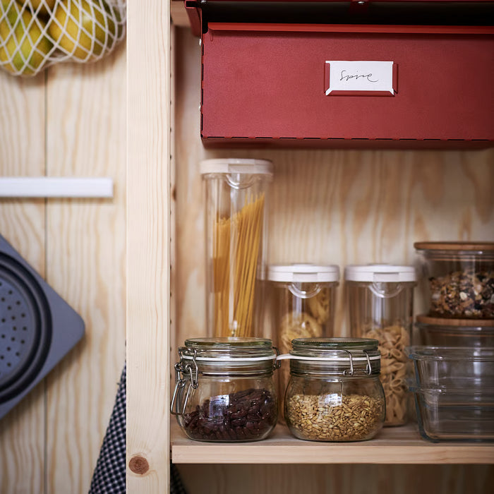 IKEA 365+ transparent storage jar with white lid close-up showing grip design and pour spout