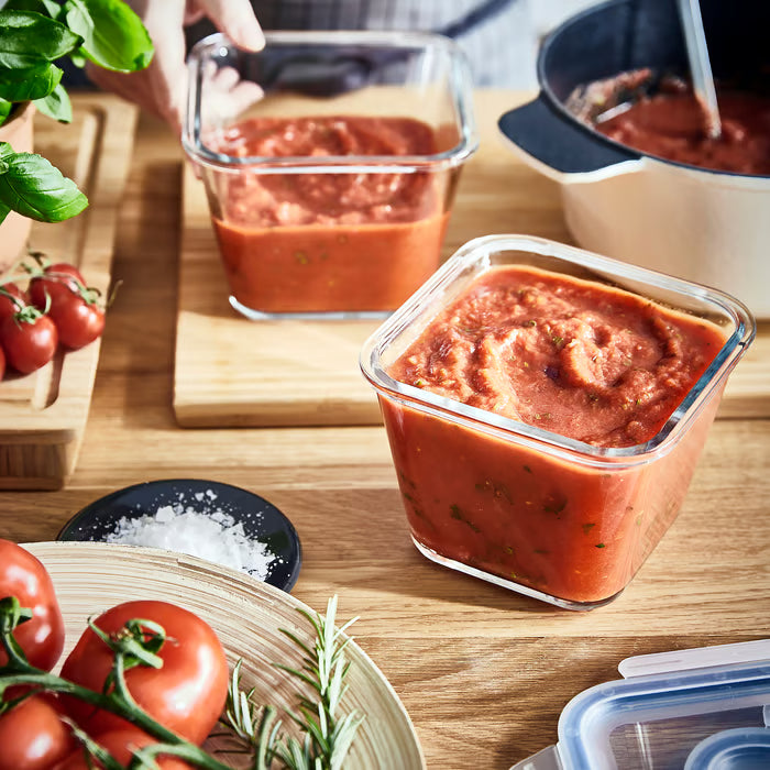 IKEA 365+ square glass containers filled with tomato sauce on wooden table showing stain-resistant glass