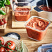 IKEA 365+ square glass containers filled with tomato sauce on wooden table showing stain-resistant glass