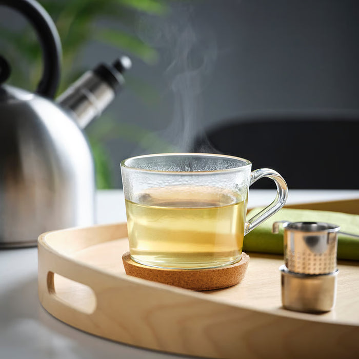  IKEA 365+ glass mug on wooden tray with steaming tea and kettle lifestyle setting