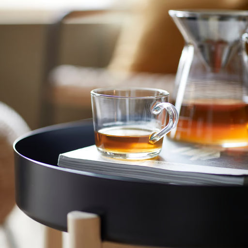 IKEA 365+ glass mug with tea on a tray with papers nearby, lifestyle setting