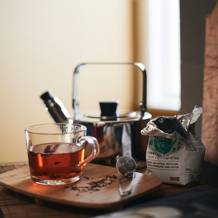 IKEA 365+ glass mug with teapot and tea bag on wooden tray showing brew visibility