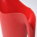 IKEA PS 2002 red watering can pouring water on indoor potted plant