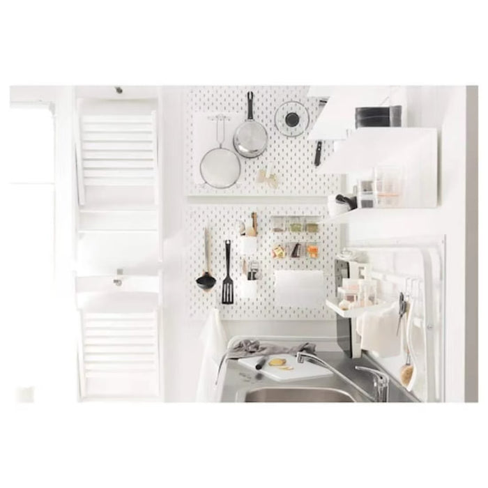 IKEA SKÅDIS white letter holder in home office setting holding tablet and files on pegboard