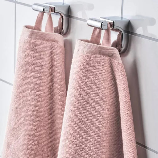  IKEA VÅGSJÖN light pink hand towel hanging on a bathroom rail showing drape and texture

