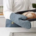 IKEA SANDVIVA blue oven glove flat lay showing full length and textile texture