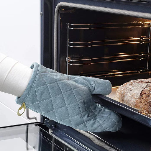 IKEA SANDVIVA blue oven glove worn on hand showing forearm coverage and fit