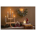 IKEA STRÅLA mini red candelabra side angle showing slim 3 cm depth and 5-arm Scandinavian silhouette