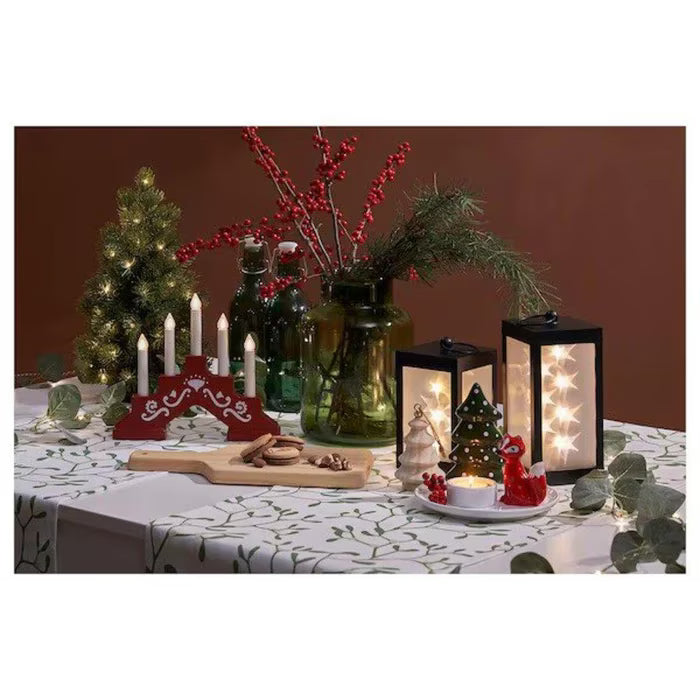 IKEA STRÅLA LED 5-armed candelabra red lit up in cosy home setting showing warm light ambience
