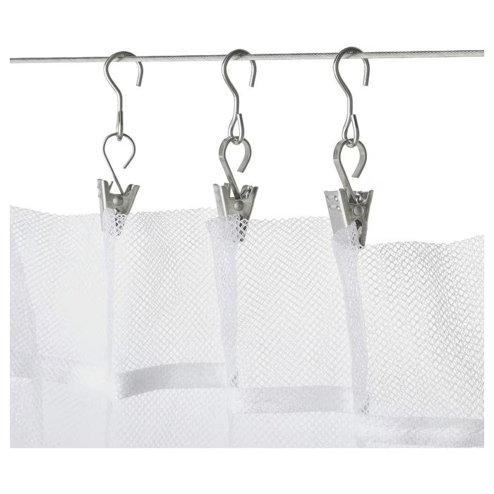 IKEA RIKTIG curtain hook with clip attached to a white curtain on a wire system