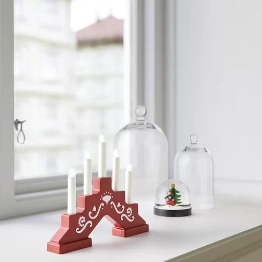 IKEA STRÅLA LED 5-armed candelabra red lit up in cosy home setting showing warm light ambience
