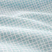 IKEA KLÄMMIG turquoise pillowcase close-up showing cotton fabric texture and colour