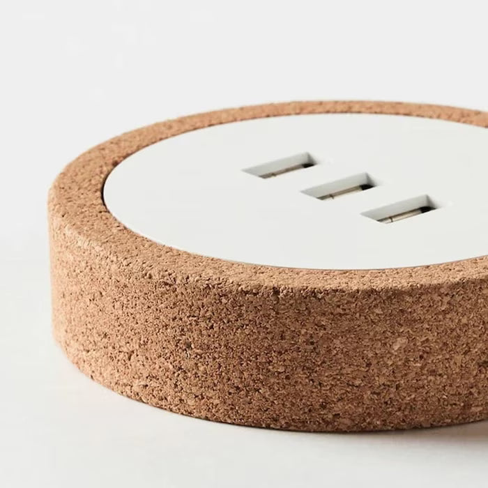IKEA NORDMÄRKE USB charger white cork close-up of USB port openings and cork ring base