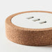 IKEA NORDMÄRKE USB charger white cork close-up of USB port openings and cork ring base