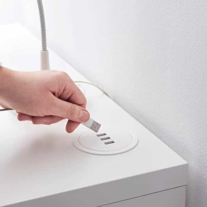 IKEA NORDMÄRKE USB charger white cork in use charging a tablet on a desk surface