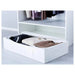 IKEA SKUBB white storage case placed flat under a bed in a bedroom setting