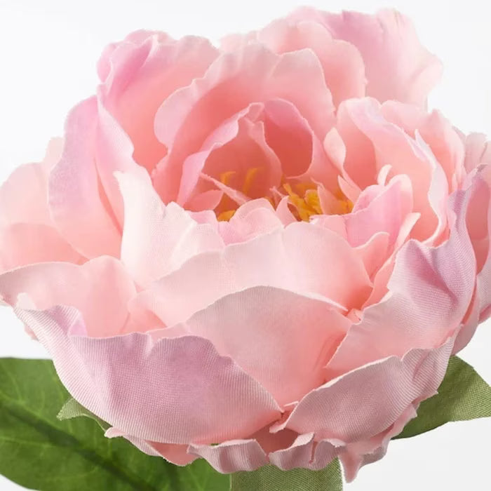 Close-up of IKEA SMYCKA artificial pink peony showing layered petal texture and lifelike finish
