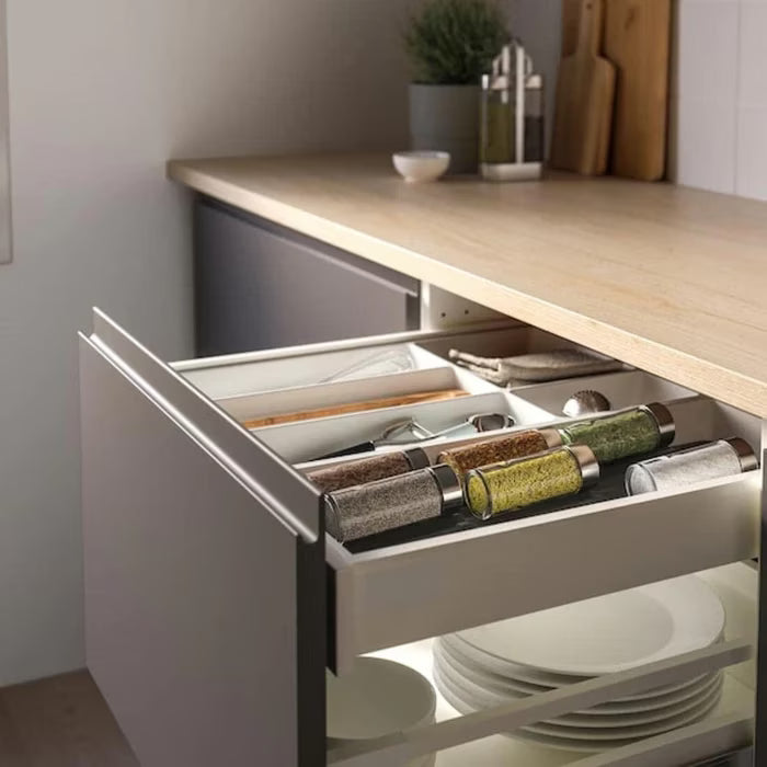 IKEA UPPDATERA spice rack in a kitchen drawer filled with various spice jars