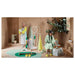 IKEA DAJLIEN yellow bath towel draped over a bathtub edge in a modern bathroom