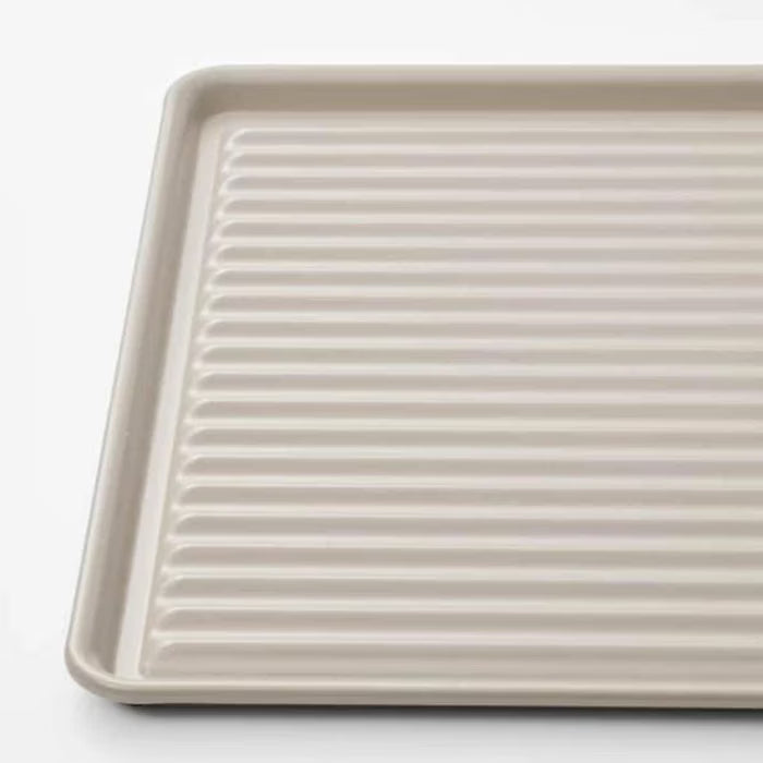 IKEA VÄLVÅRDAD beige dish drainer side angle showing 2 cm low-profile height near sink