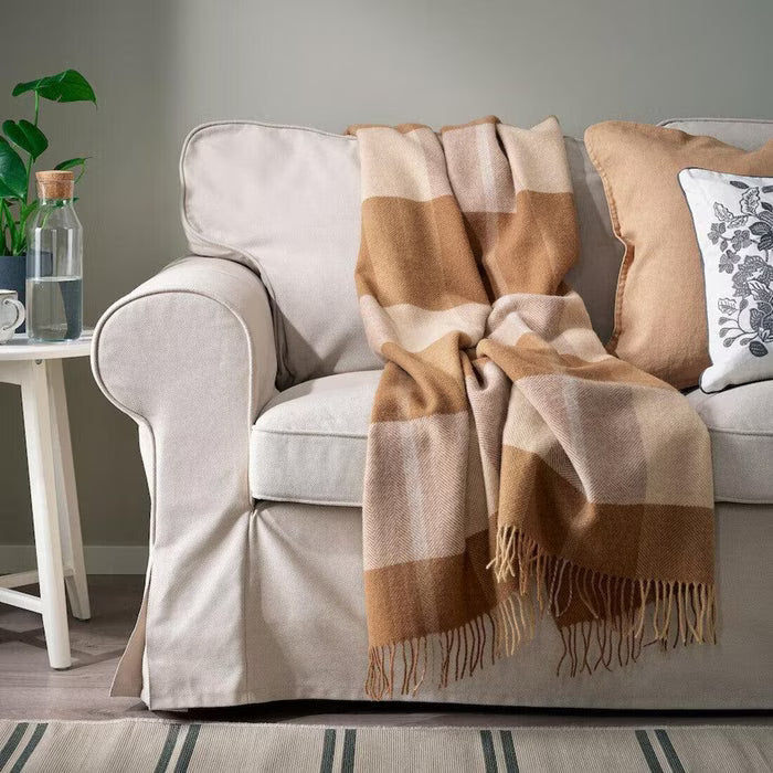 IKEA MYRULL wool throw light brown laid flat on bed showing full 130x170 cm size