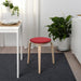 IKEA SUNNEA chair pad red close-up showing Lofallet fabric texture and stitched edge detail