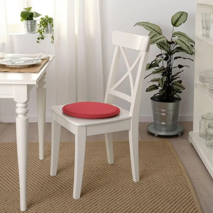 IKEA SUNNEA red chair pad placed on wooden stool showing flexible round fit