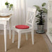 IKEA SUNNEA red chair pad placed on wooden stool showing flexible round fit
