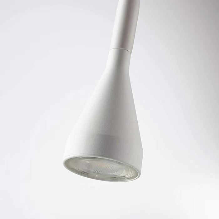 IKEA NÄVLINGE LED spotlight white on study desk with warm light illuminating workspace
