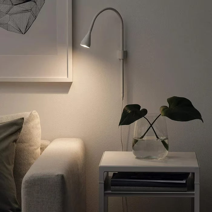 IKEA NÄVLINGE white clamp spotlight mounted as wall lamp in room setting