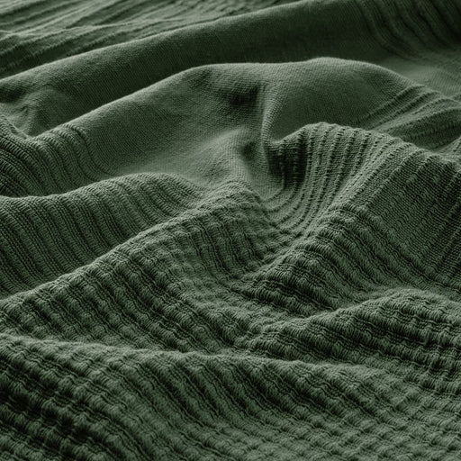 IKEA INDIRA grey-green cotton bedspread close-up showing woven texture and folds