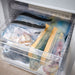 Freezer drawer organised with IKEA ISTAD transparent zip bags holding frozen food items